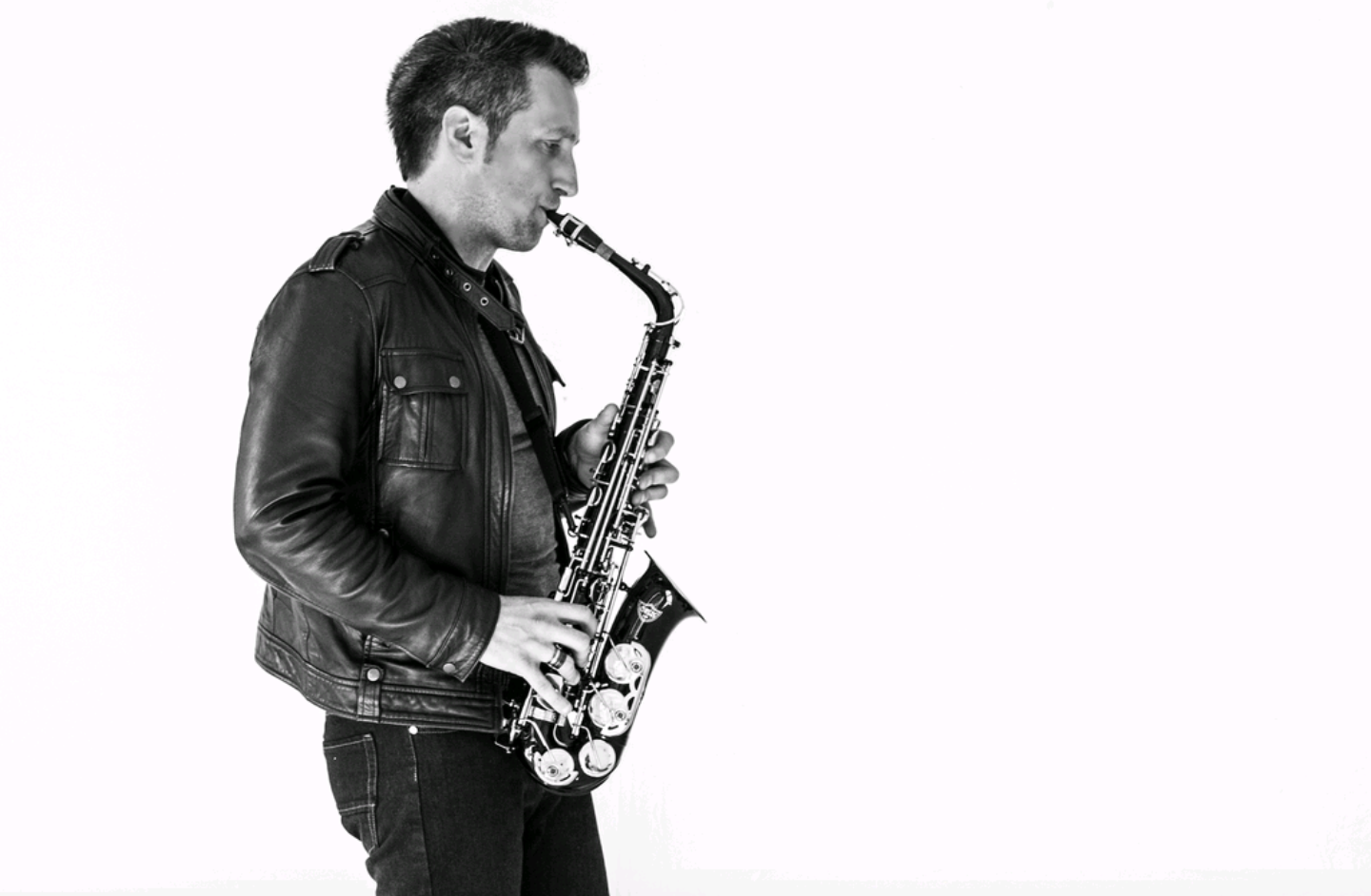Black-and-white portrait of James Everett with saxophone