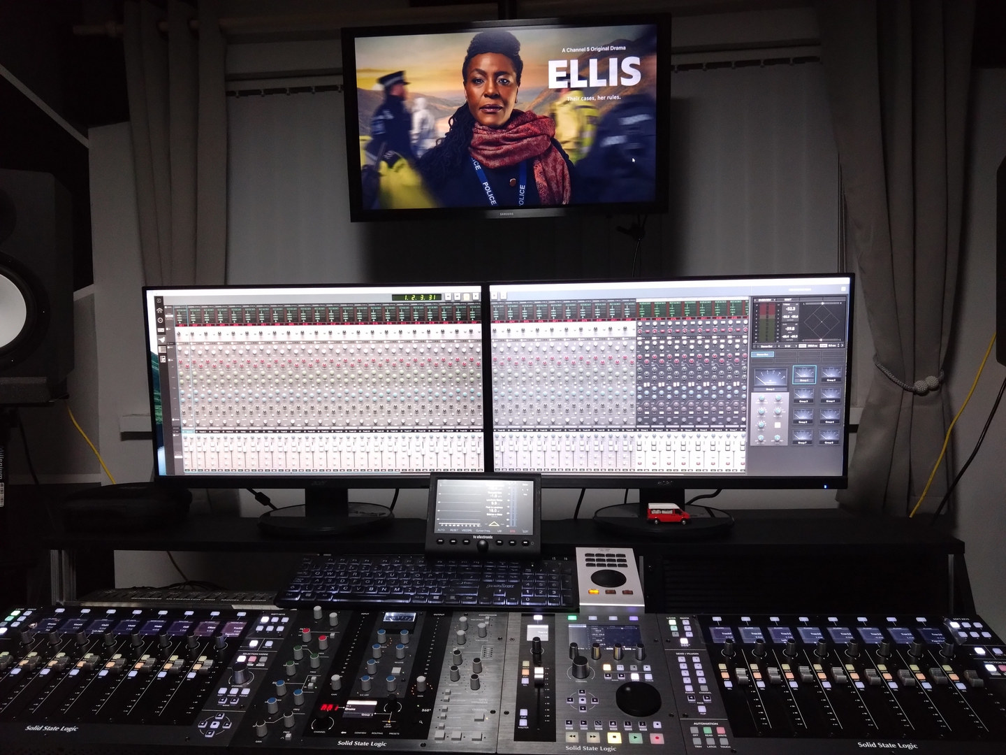 Studio console with Ellis on screen